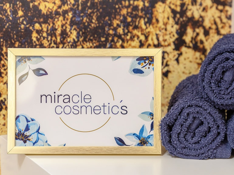 miracle cosmetics logorahmen und handtücher